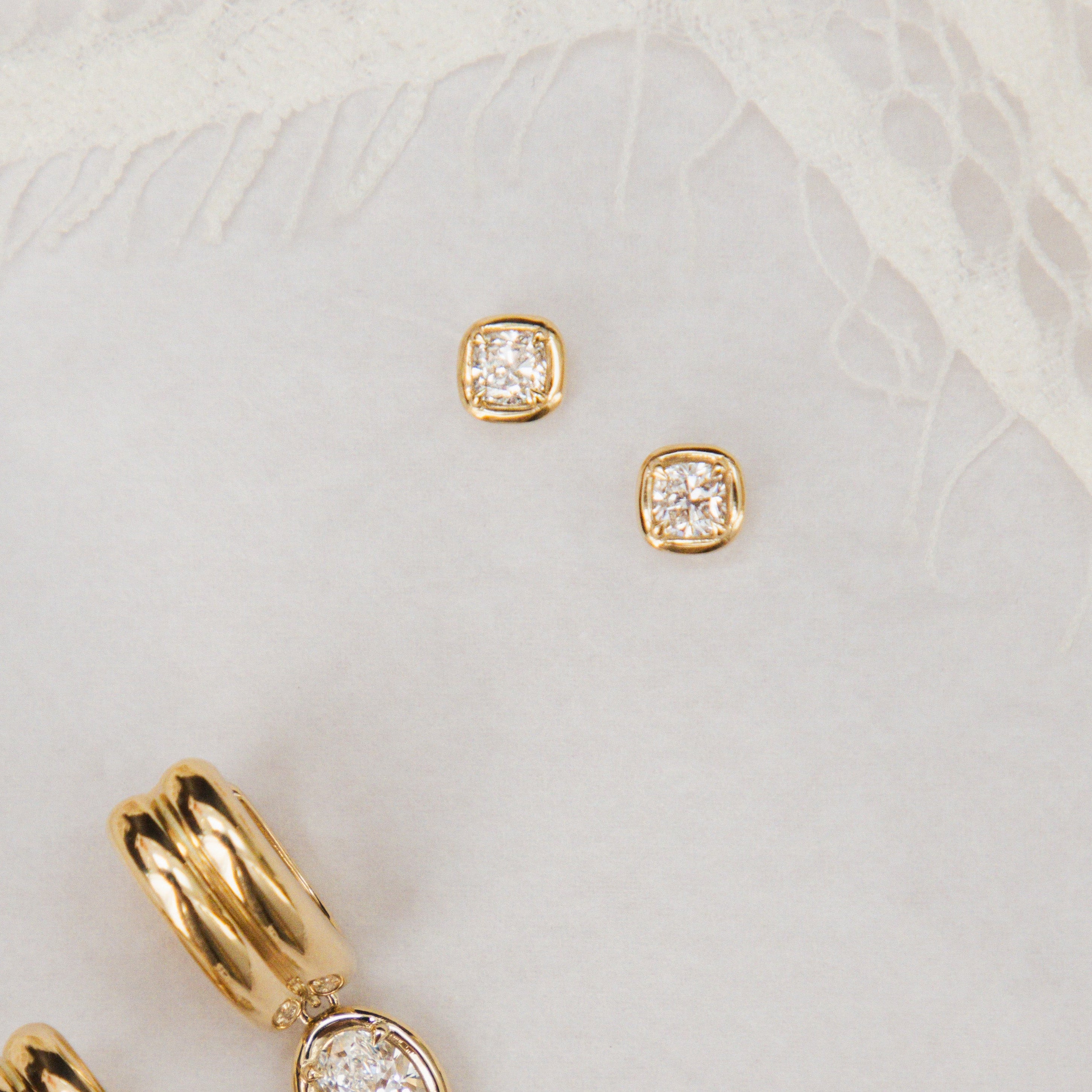 Flat lay of Nina Cushion Studs