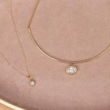 Flat lay of Nina Cushion Pendant and Odette Oval Collar