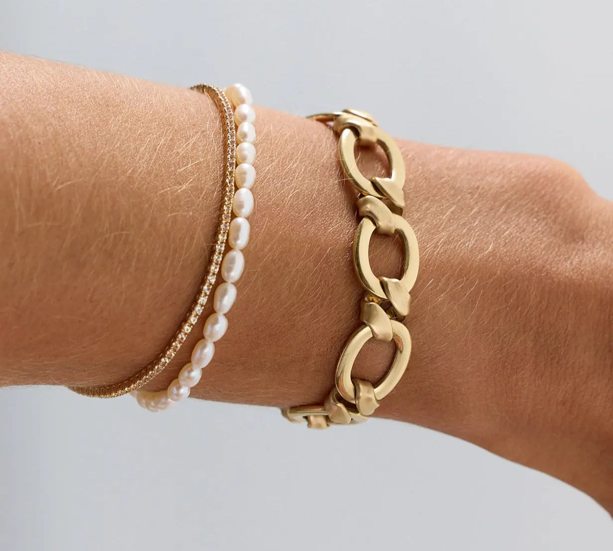 Everyday Pearl Bracelet on wrist styled with other Marrow Fine bracelets