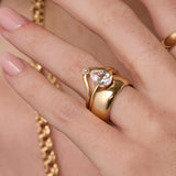 Close up of woman's hand spotlighting various Marrow Fine rings