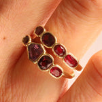 Close up of f 1.00tcw Ruby and 0.90ct Sapphire Linear Band and 1.20ctw Ruby Linear Band stacked on woman's hand