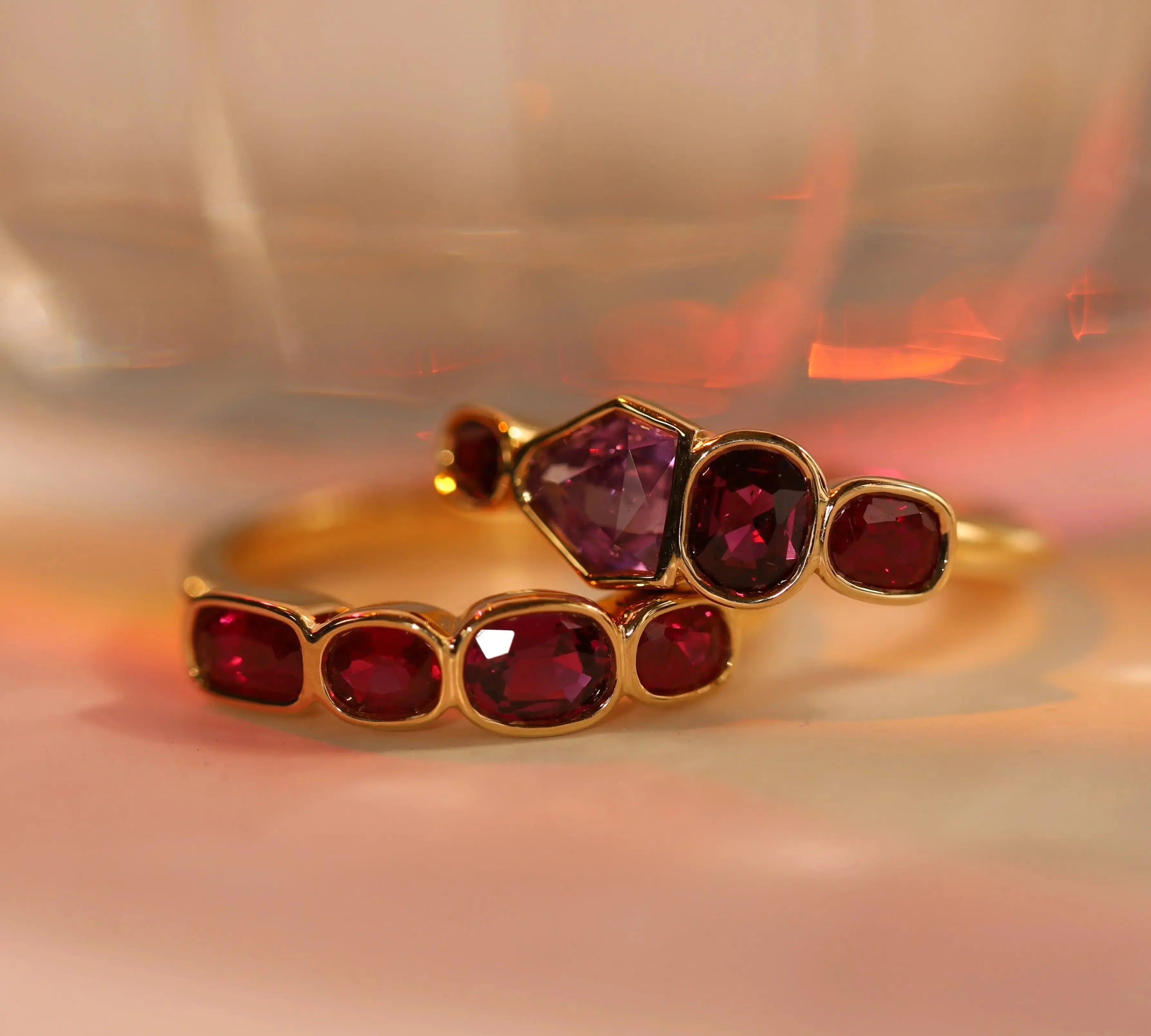 Flat lay of 1.00tcw Ruby and 0.90ct Sapphire Linear Band and 1.20ctw Ruby Linear Band