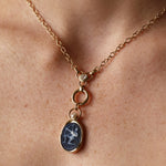 Sagittarius Zodiac Black Agate Carving with Pearl pendant – white archer carved on black agate in 14k yellow gold, with a white cultured pearl above the carving