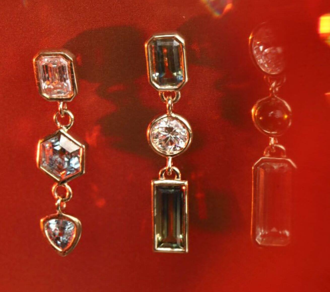 close up of Sapphire and Opal Bezel Set Dangle Earrings from the Kaleidoscope Collection