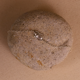 Silver bracelet on a textured stone surface