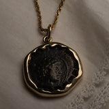 Seleucid Kingdom coin pendant worn on a chain, showing the profile of Antiochos VI Dionysos