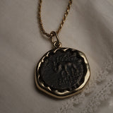 Seleucid Kingdom coin pendant worn on a chain, showing the elephant side