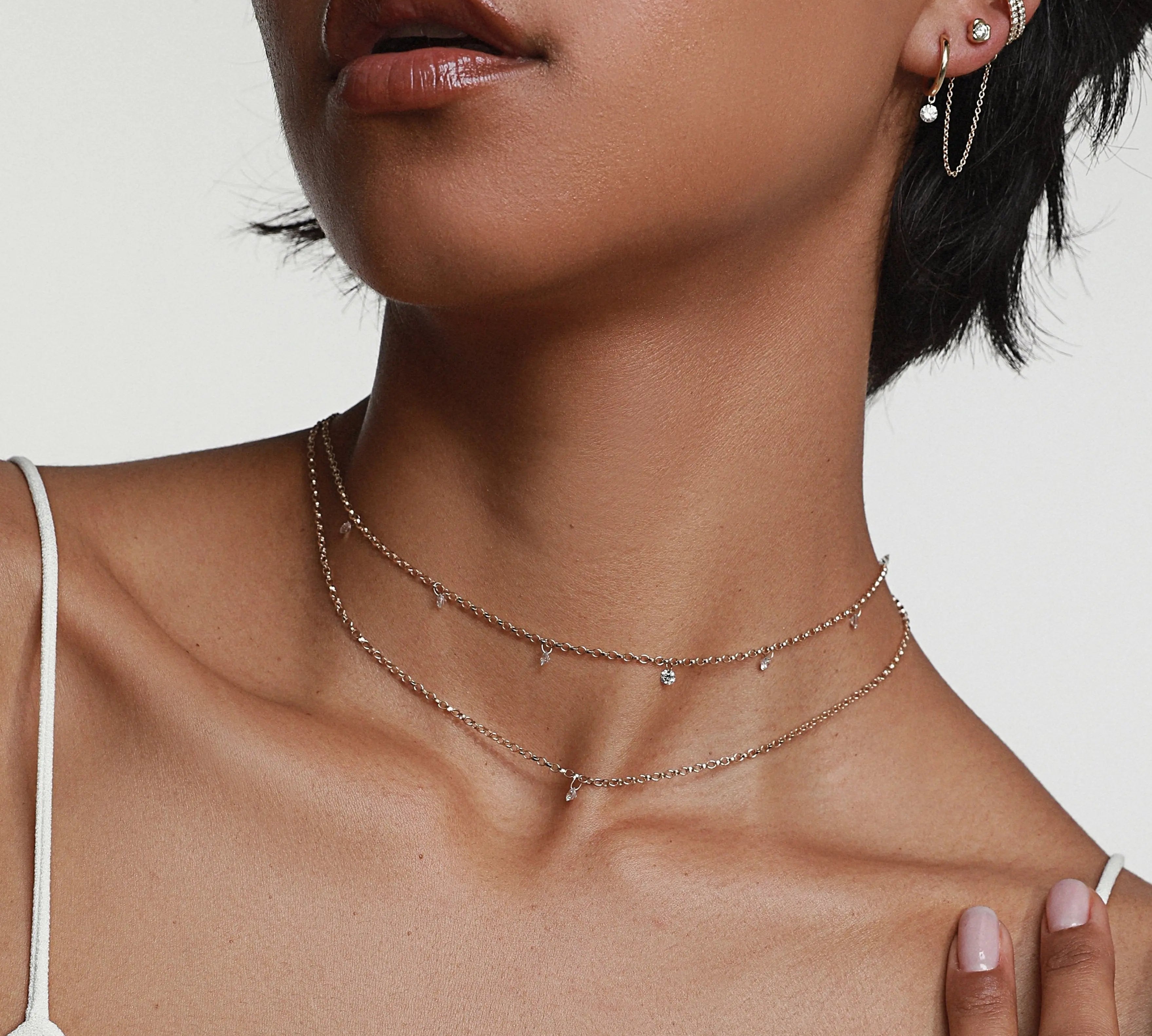 close up of woman's décolletage featuring the Seven Stone Diamond Drop Choker