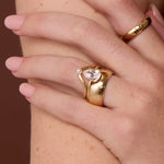 The Sloane Pear Solitaire Engagement Ring, close up on hand