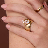 The Sloane Pear Solitaire Engagement Ring, close up on hand