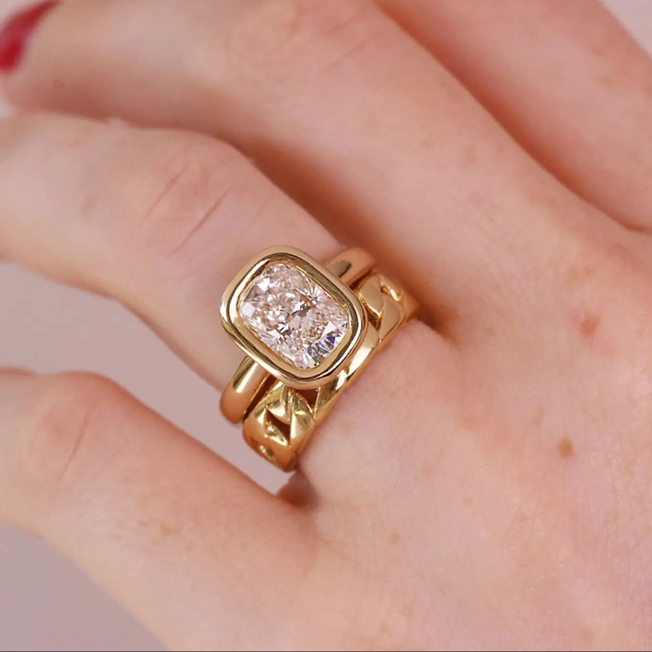 Stevie engagement ring stacked with cuban chain ring on hand