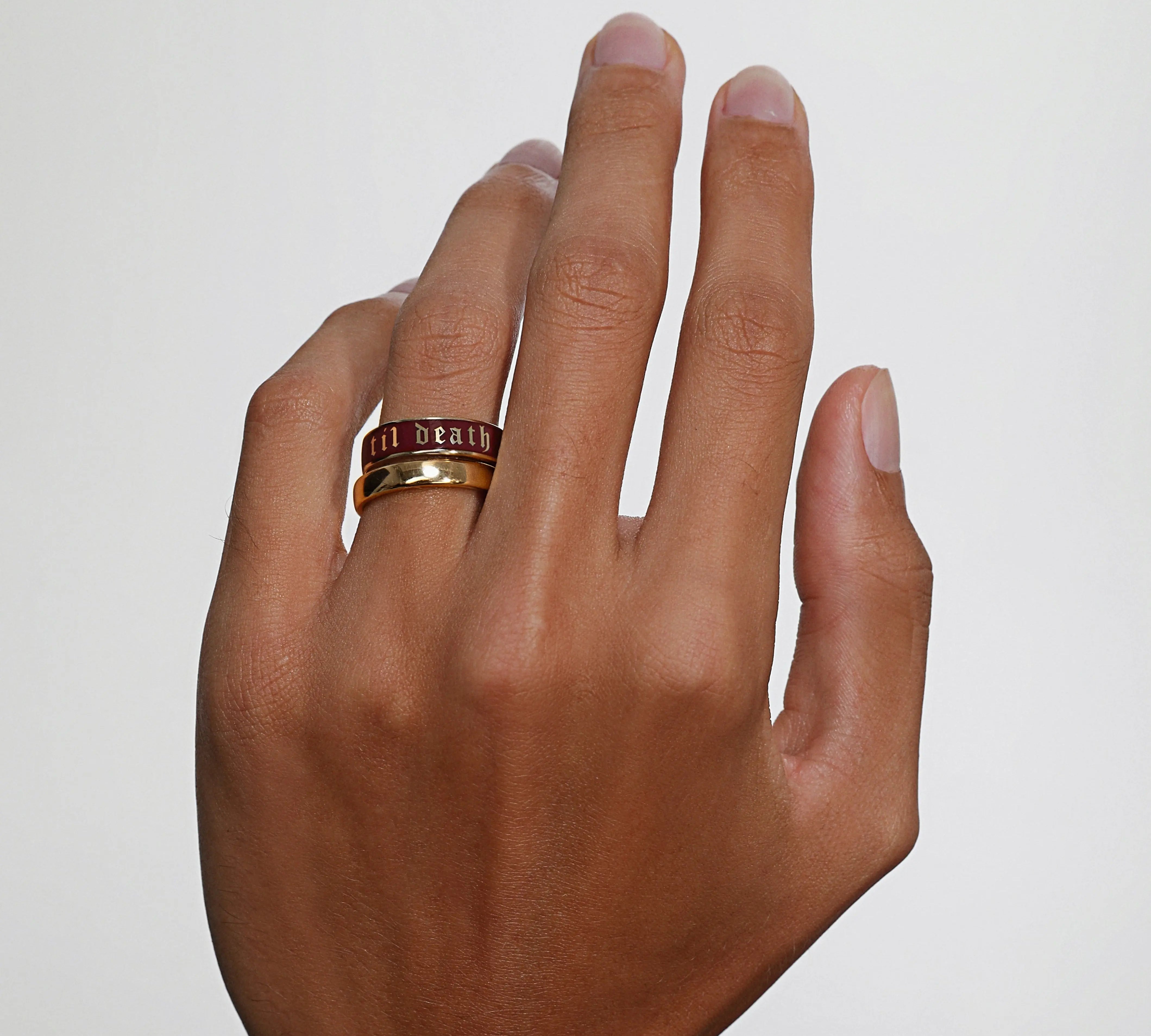Close up of man's hand wearing the Til Death Cherry Mocha ring in 6mm