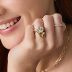 Close up of woman with hands near her face, wearing the Asymmetrical Sculpted Band