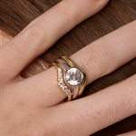 The Tessa Bezel Round Solitaire Engagement Ring close up on hand