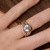 The Tessa Bezel Round Solitaire Engagement Ring close up on hand