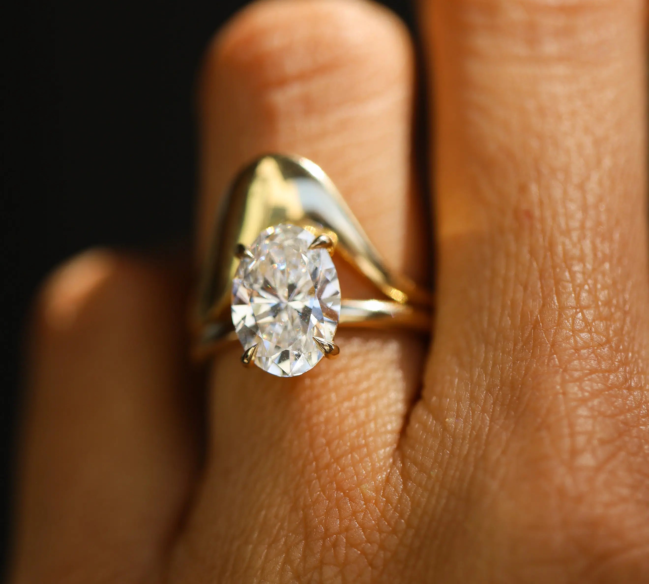 The Francesca Oval Engagement Ring close up on finger