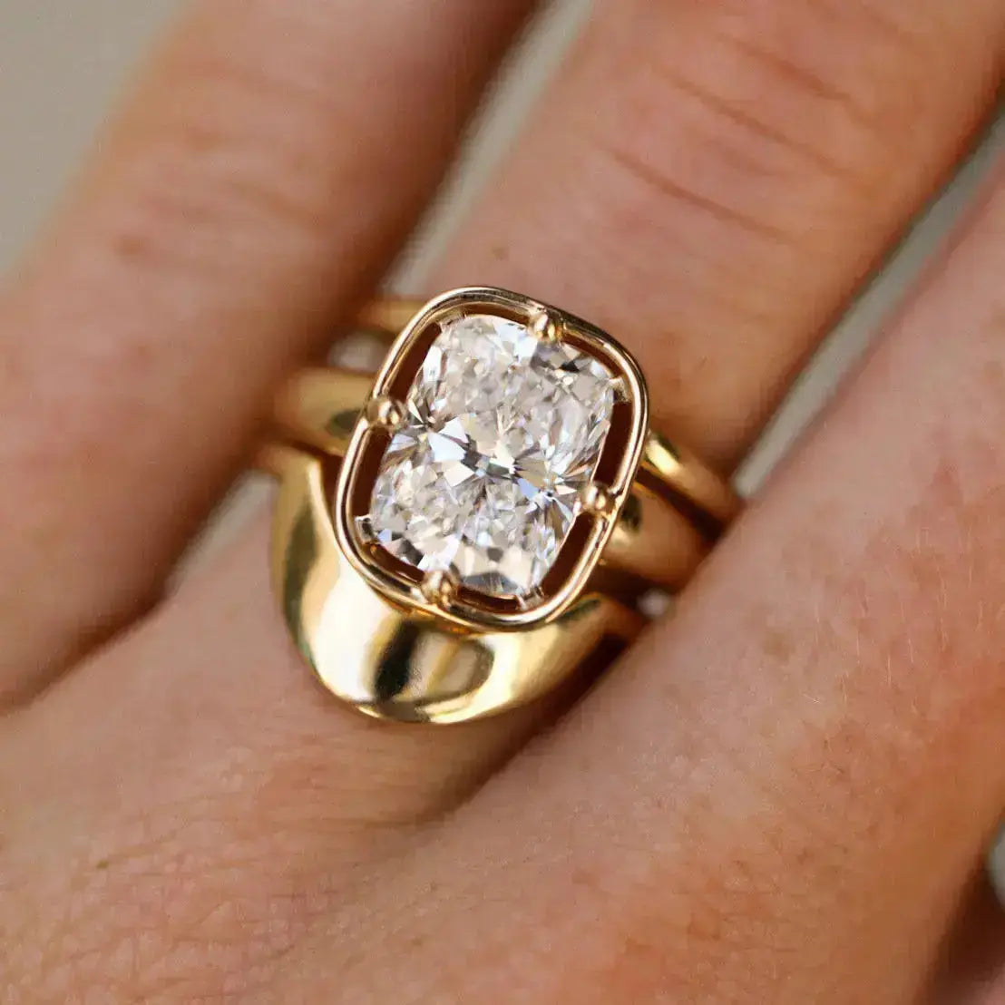 Gold ring with a diamond on a finger