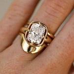 Gold ring with a diamond on a finger
