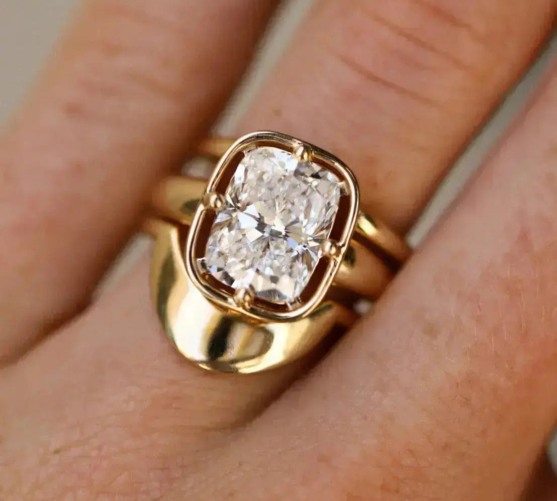 Gold ring with a diamond on a finger