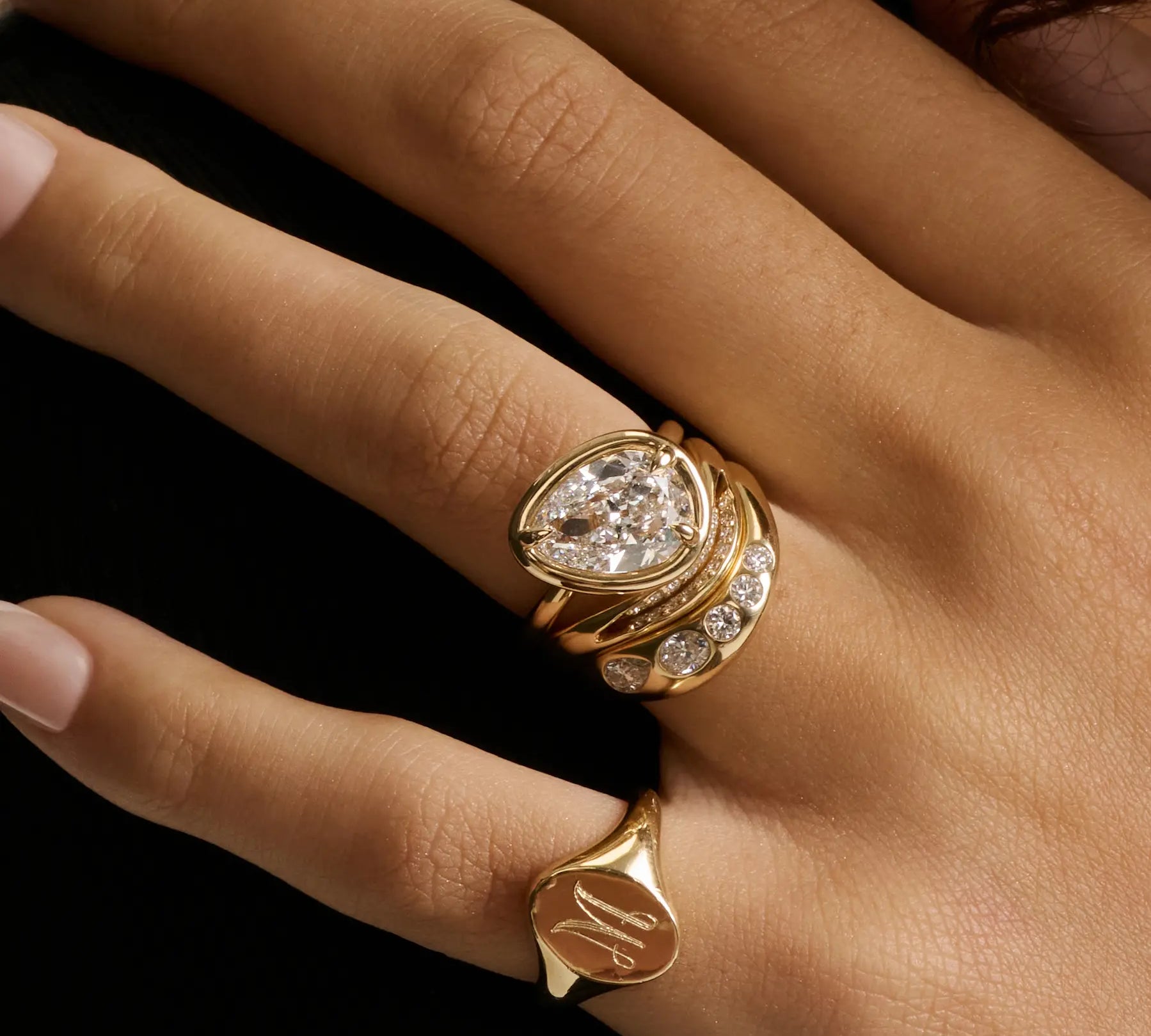 The Paloma Tilted Pear Engagement Ring with a pear diamond set on a subtle tilt in a bezel