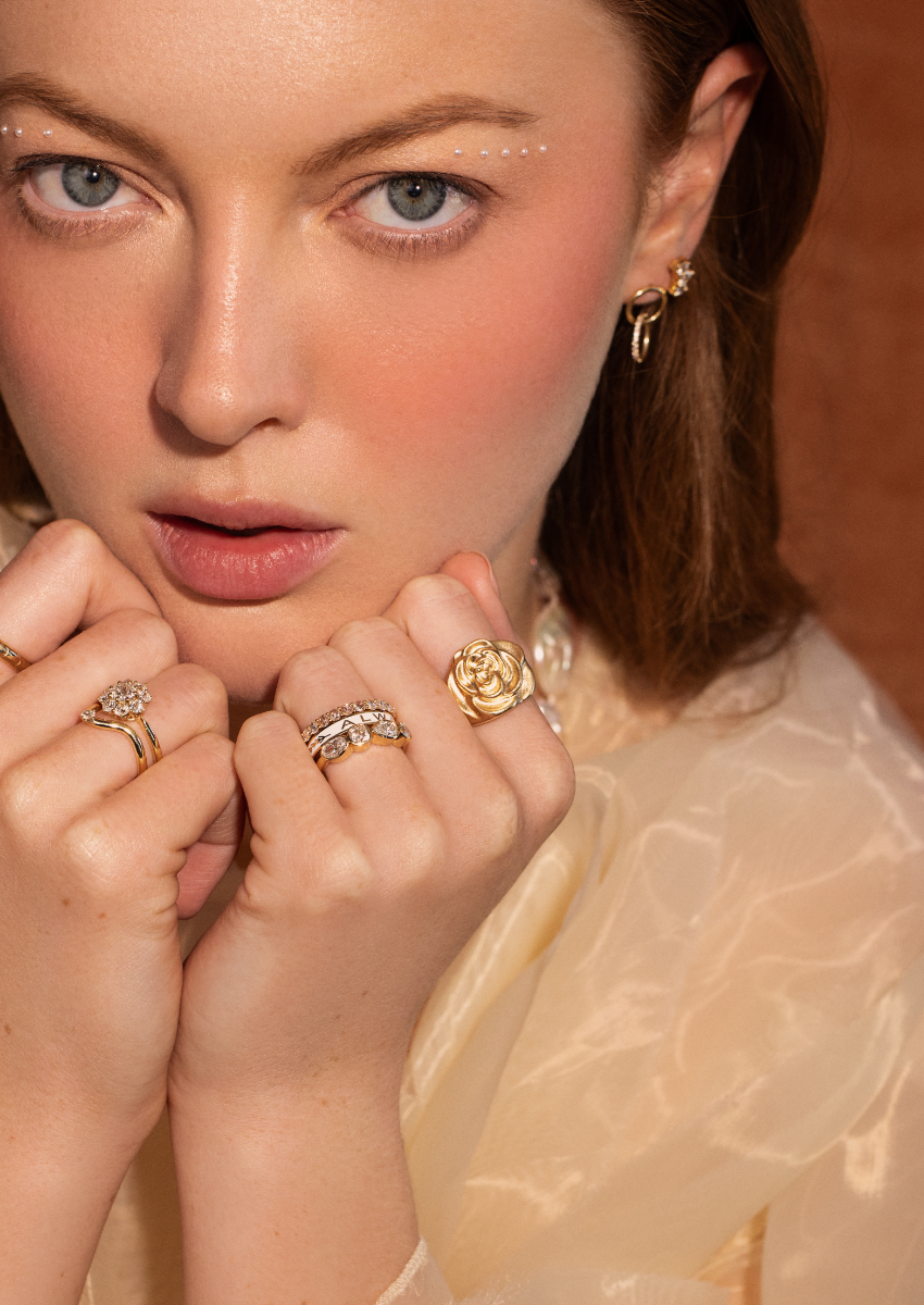 woman looking at camera with Marrow Fine rings and earrings 