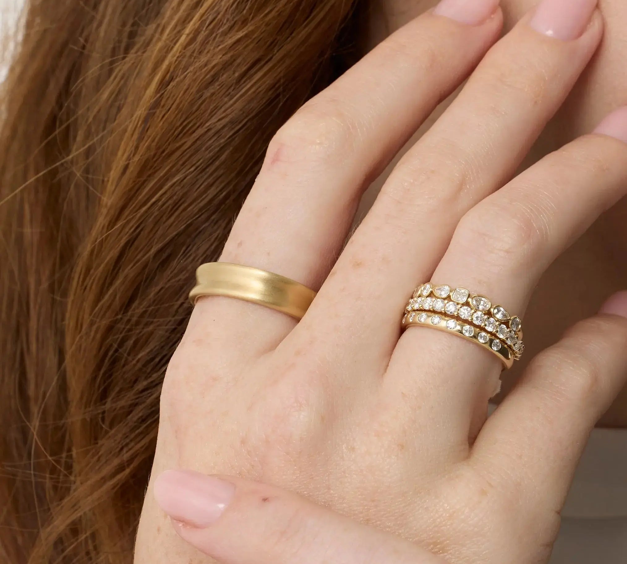 Close up of Everyday Vale Ring styled on hand + other Marrow Fine White Diamond Bands