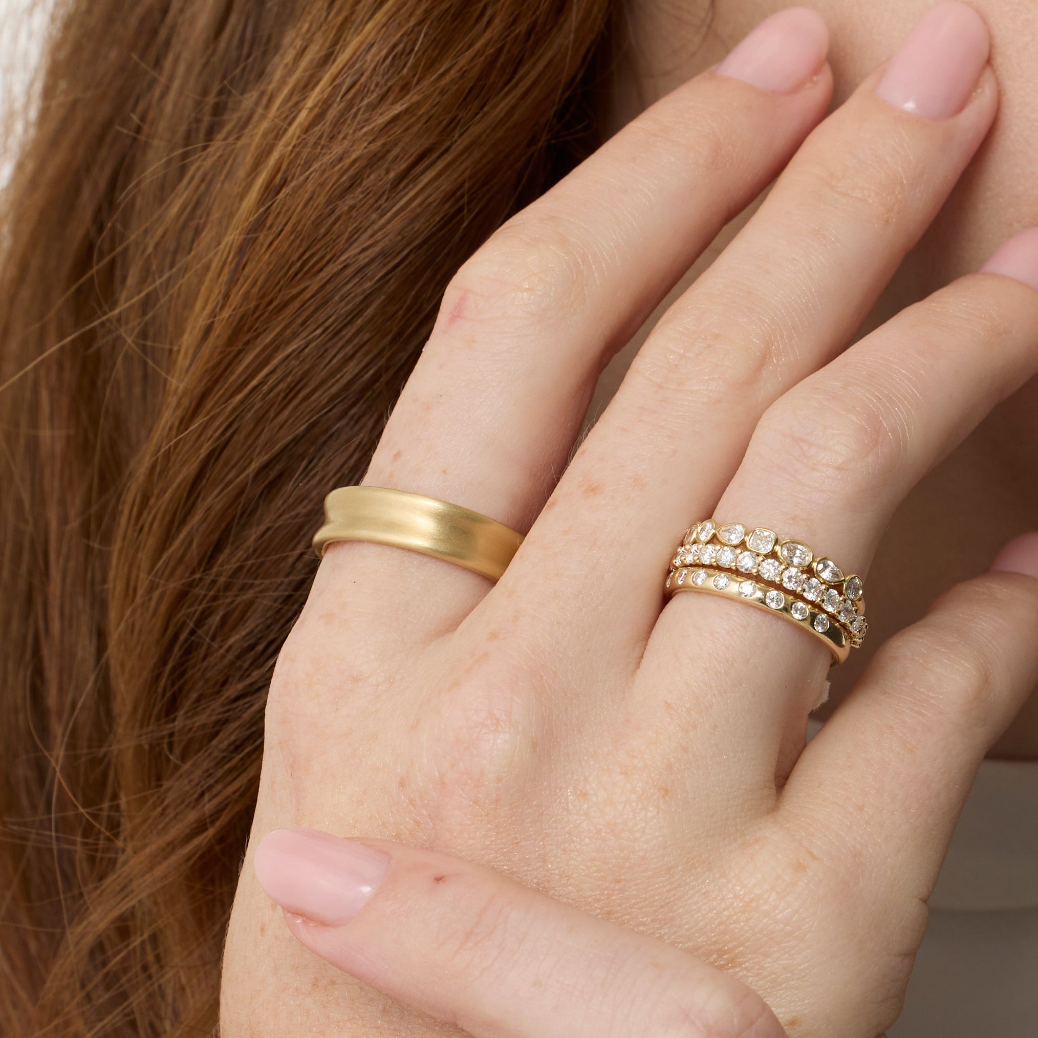 Close up of Everyday Vale Ring styled on hand + other Marrow Fine White Diamond Bands