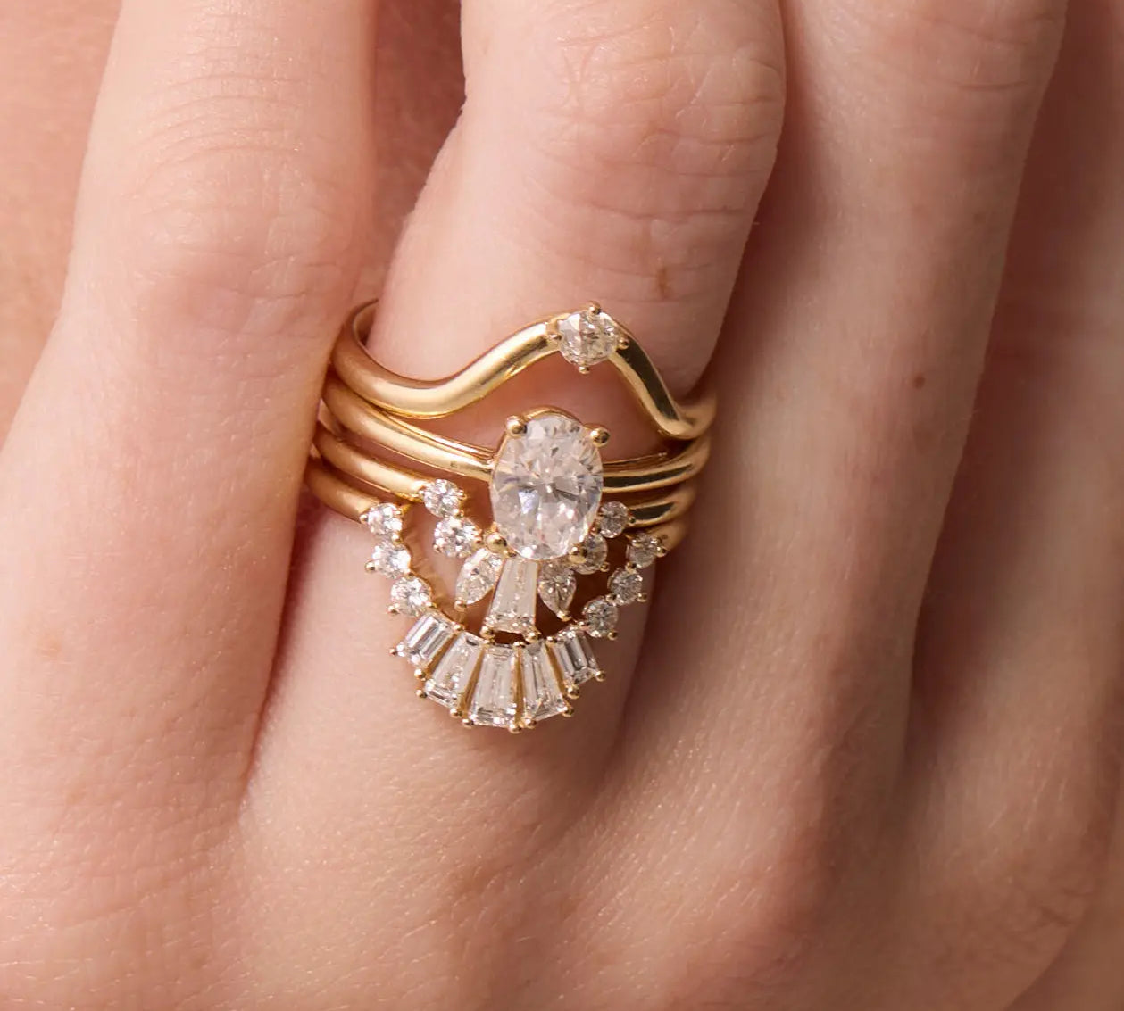Close up of White Diamond Gemma Ballerina Ring and other white diamond bands on hand