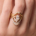 Close up of White Diamond Gemma Ballerina Ring and other white diamond bands on hand