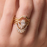 Close up of White Diamond Gemma Ballerina Ring and other white diamond bands on hand
