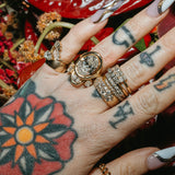 Close up of Sammi Jefcoate's hands, featuring the Marrow x Sammi Florence Engagement Ring, stacked with the Arno Serpent Band