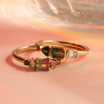 Flat lay of 0.37ct Watermelon Tourmaline, Sapphire, Tourmaline and Diamond Kaleidoscope Ring and 0.44ct Watermelon Tourmaline, Sapphire, Tourmaline and Diamond Kaleidoscope Ring