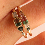 Close up of 0.37ct Watermelon Tourmaline, Sapphire, Tourmaline and Diamond Kaleidoscope Ring and 0.44ct Watermelon Tourmaline, Sapphire, Tourmaline and Diamond Kaleidoscope Ring stacked on woman's hand
