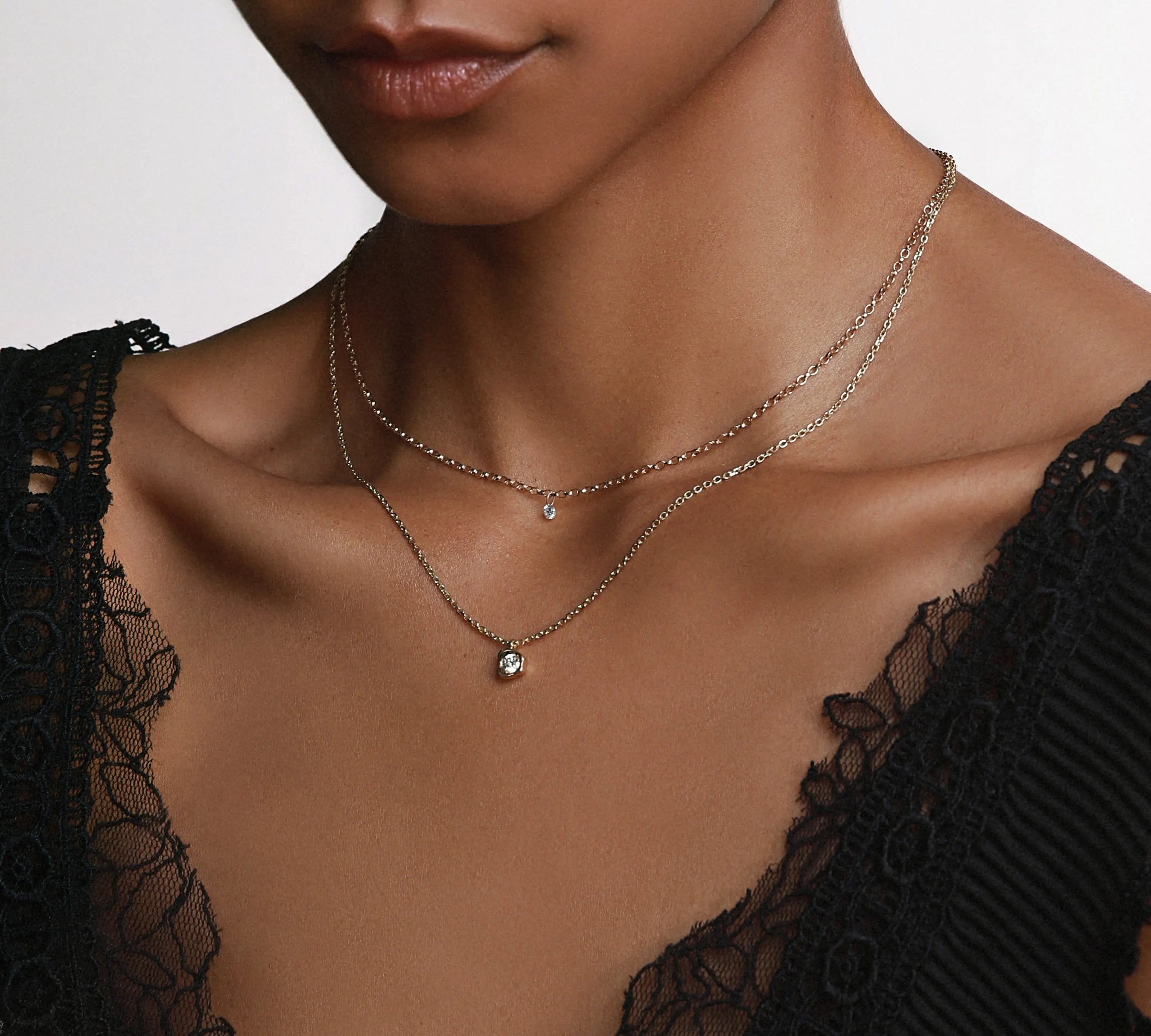 White Diamond Abstract Bezel Necklace close up on woman's décolletage 