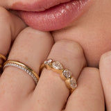 Close up of woman resting hands against chin with the Marrow Fine White Diamond Mixed Shape Bezel Band