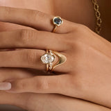 The Abstract Bezel Oval Engagement Ring stacked with the Asymmetrical Sculpted Band and White Diamond Abstract Bezel Band on hand