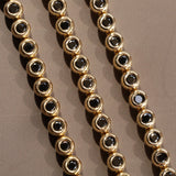 Black Diamond Bezeled Tennis Bracelet [flat lay]