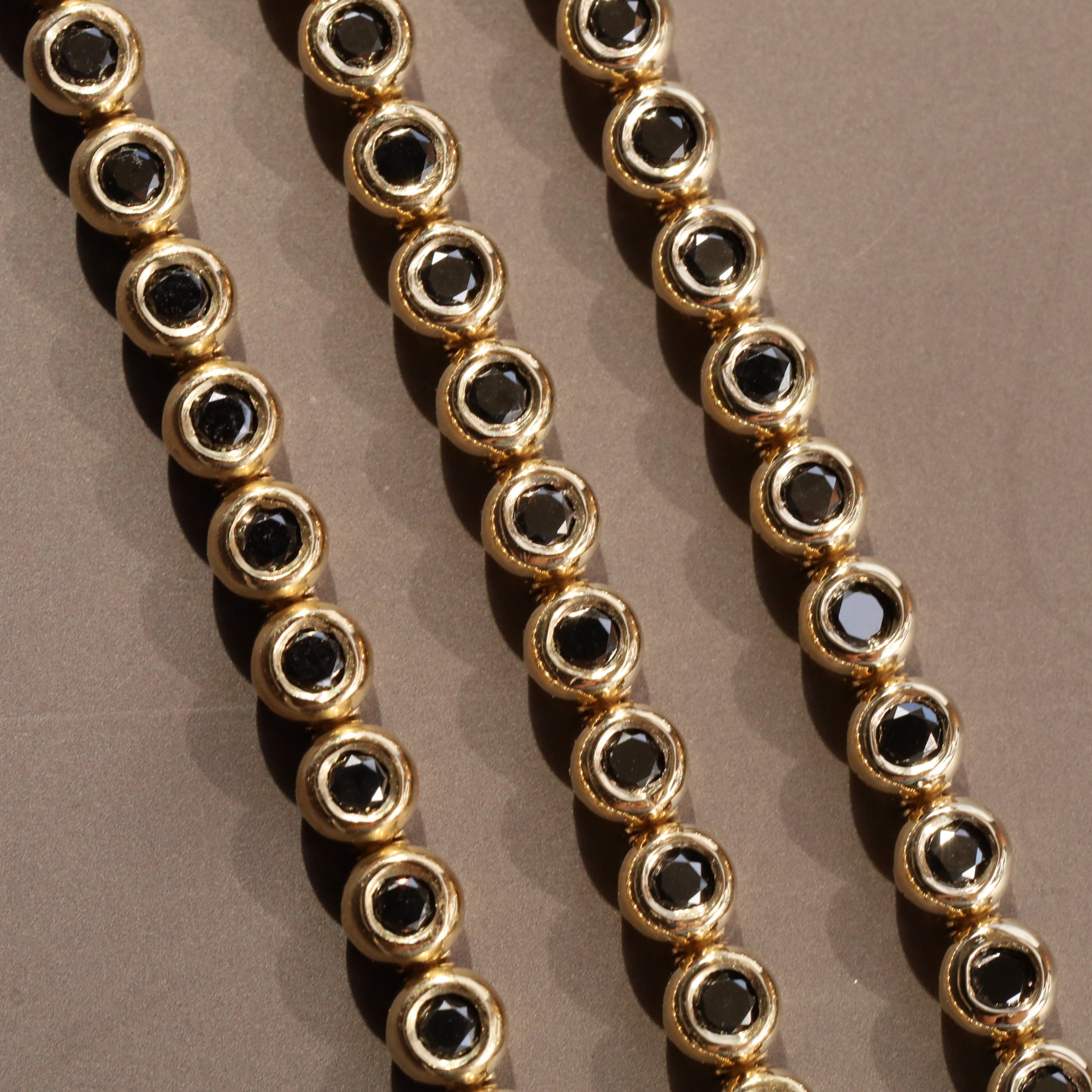 Black Diamond Bezeled Tennis Bracelet [flat lay]
