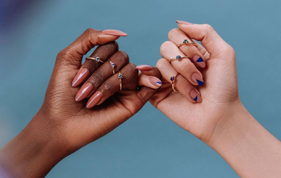 two hands with Marrow rings with pinky fingers intertwined