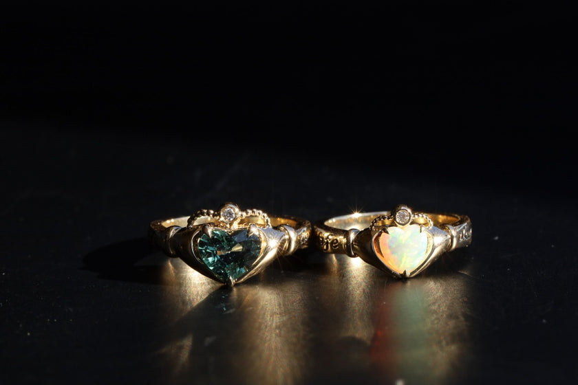 sapphire and opal Sempre rings side by side