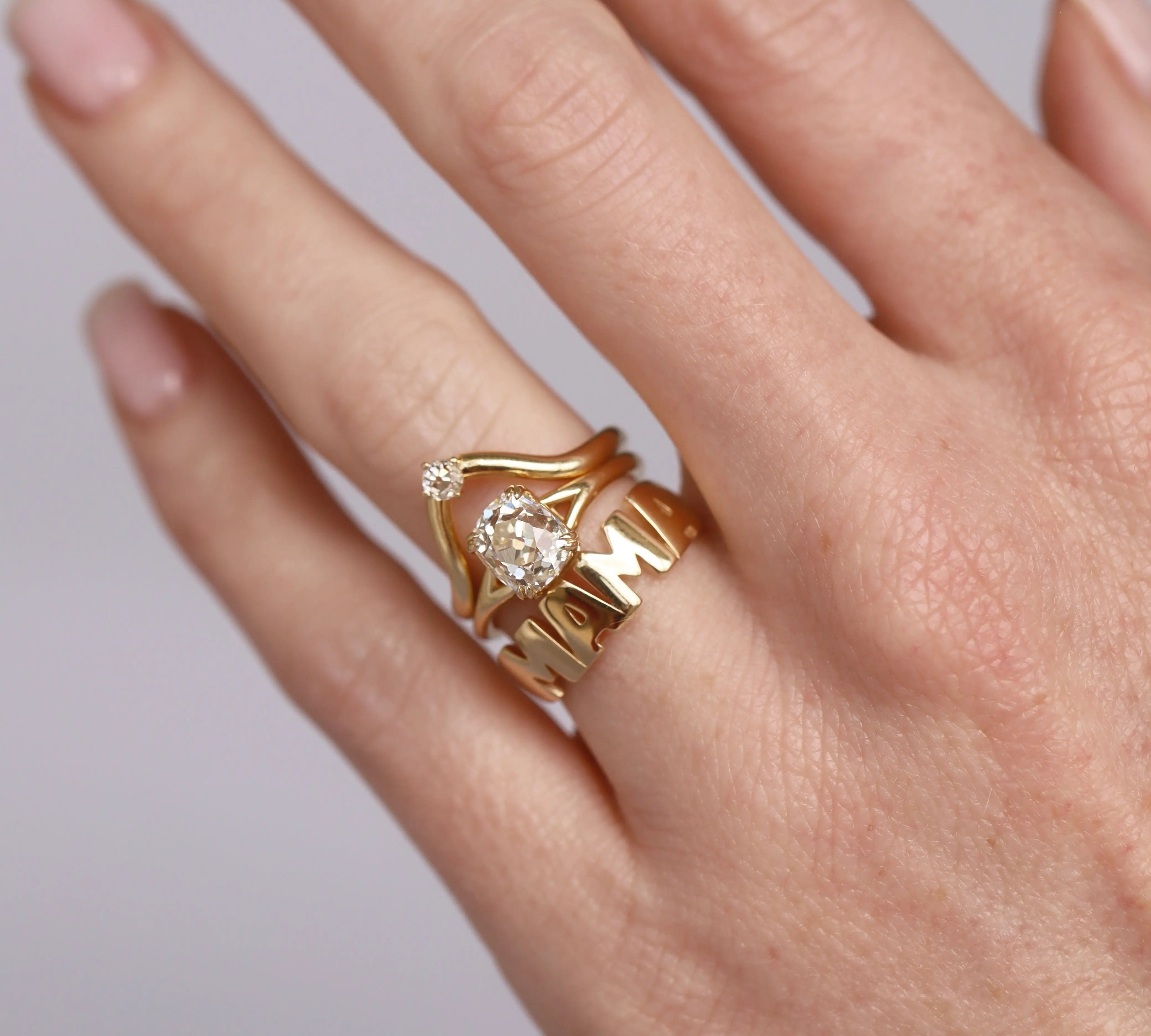 Mama Nameplate Ring stacked with a diamond ring on the hand