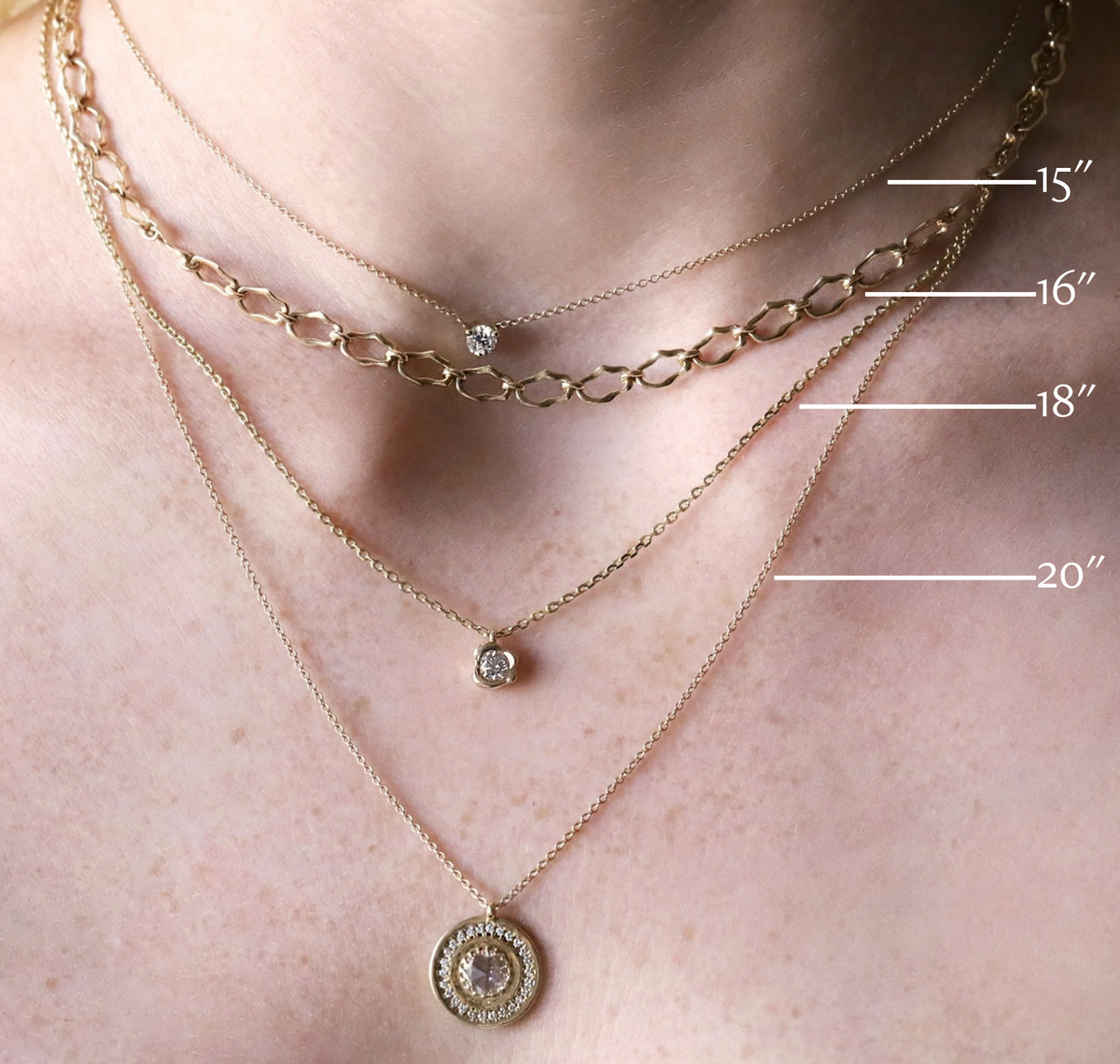 Necklace length guide on a model showing chains at 15, 16, 18 and 20 inches