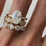 Vide of White Diamond Mixed Shape Bezel Band stacked on hand