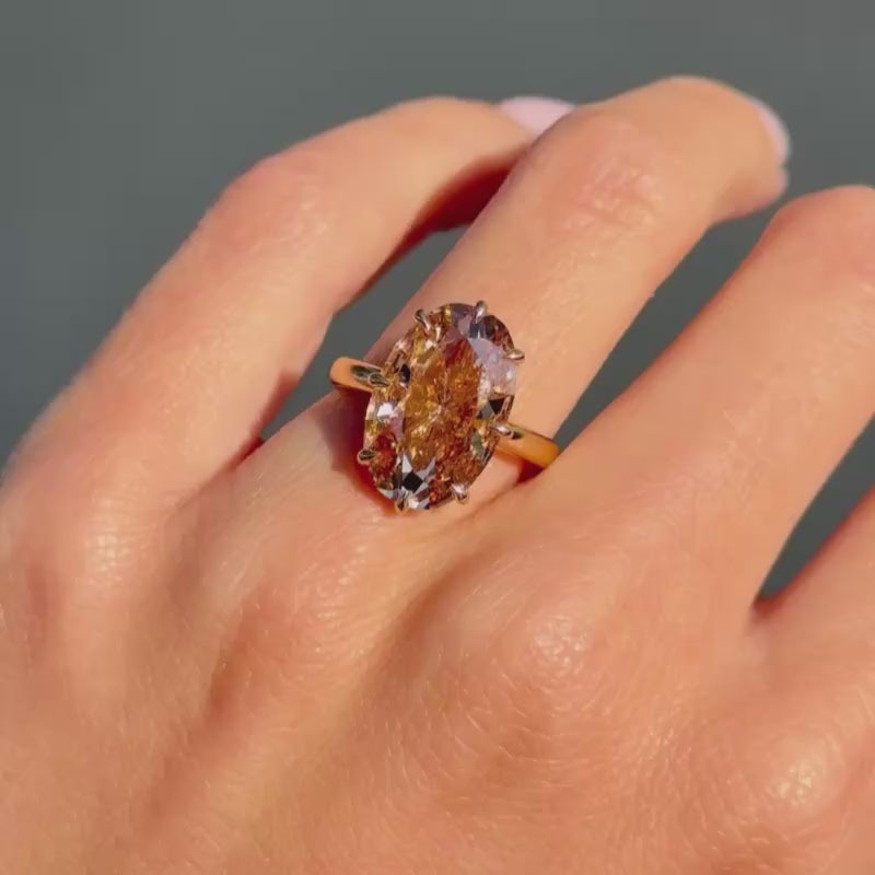 Video of 5.46ct Fancy Brown Diamond enagement ring on hand in the light