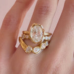 Video of the Simone Arch Band nested under The Abstract Bezel Oval Engagement Ring on hand