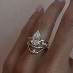 Video of the White Diamond Walton Band and Cosmic Light Open Shank Band stacked with a pear diamond engagement ring on hand