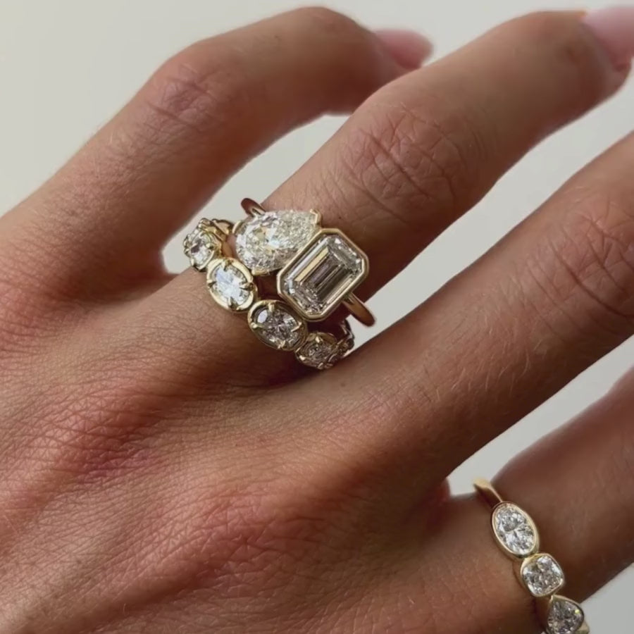 The Inez Toi et Moi Engagement Ring on hand, white background