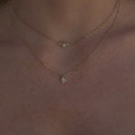 Video of White Diamond Abstract Bezel Necklace and Juliette Opal Necklace layered together on woman's neckline