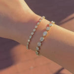 video of Lisse Tennis Bracelet + Mini Lisse Tennis Bracelet on wrist against a brown background