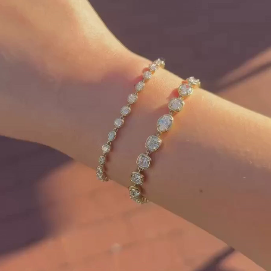 video of Lisse Tennis Bracelet + Mini Lisse Tennis Bracelet on wrist against a brown background